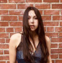 We listen to Indie solo singer songwriter Amelie Lucille